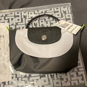 Longchamp Mini Pouch. New. With Bloomingdale’s receipt.